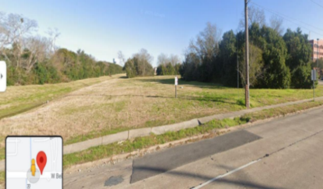 The terminus of the Brays Oaks Trail South at West Bellfort and the school shown to the right.